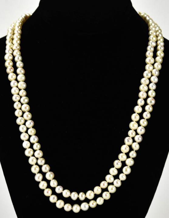 Hand Knotted Baroque Pearl Necklace Strand: Hand Knotted Baroque Pearl Necklace Strand. Hand knotted on white silk thread. Measures 48 inches in length.
