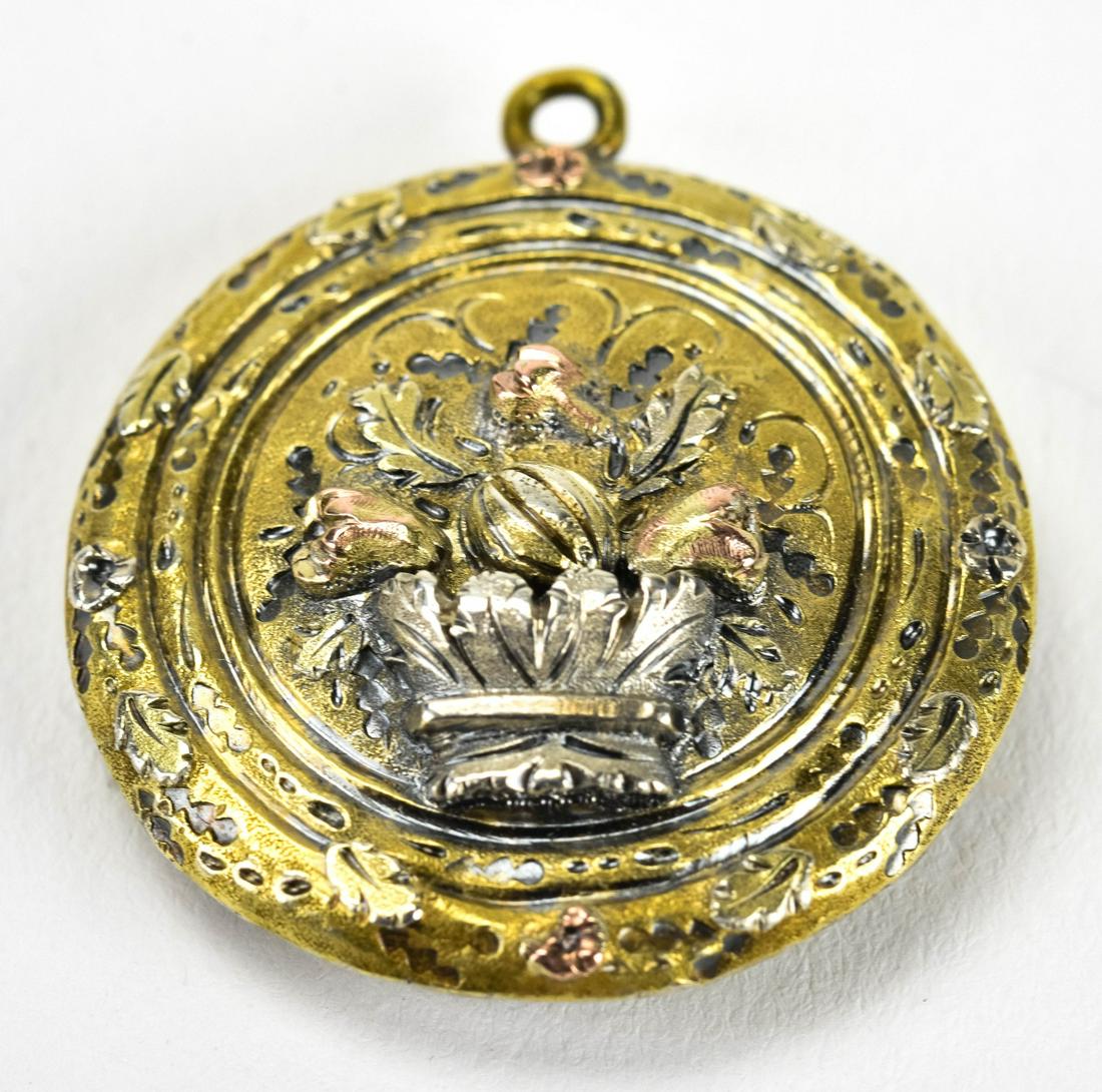 Antique Georgian C 1820 Gold Cased Locket Pendant: Antique Georgian C 1820 Gold Cased Locket Pendant. Repousse floral scene on front, glass panel on back. Measures 1.5 inches in length.