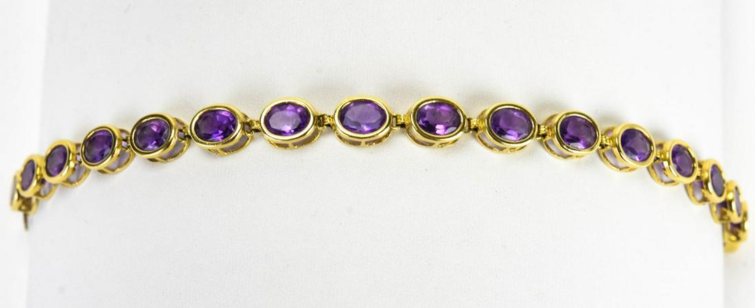 Estate 14kt Yellow Gold & Amethyst Tennis Bracelet: Estate 14kt Yellow Gold & Amethyst Tennis Bracelet. Hallmarked. Measures 7.75 inches in length. Weighs approximately 12.4 grams inclusive.