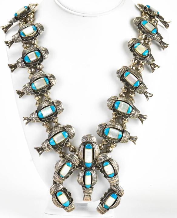 Vintage Silver & Turquoise Squash Blossom Necklace: Native American Vintage Silver & Turquoise w Mother of Pearl Squash Blossom Necklace. Tests as silver but apparently unmarked. Measures 30 inches in length plus central pendant. Weighs approximately 2
