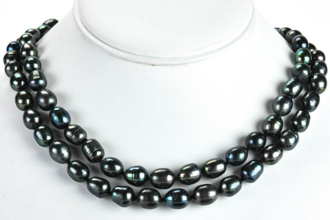 Pair Hand Knotted Baroque Tahitian Pearl Necklaces: Pair Hand Knotted Baroque Tahitian Pearl Necklaces. Hand knotted on silk thread. Pearls with tones of silver, black and gray. Filigree Clasps. Each measures 18 inches in length.