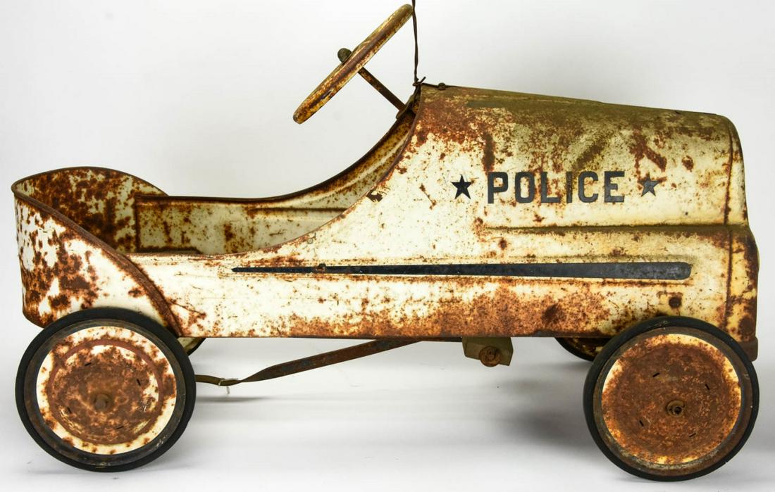 Vintage Child Size Metal Ride-On Police Car Toy: Vintage Child Size Metal Ride-On Police Car Toy. With pedals. Measures 19 inches x 31 inches x 12 inches.