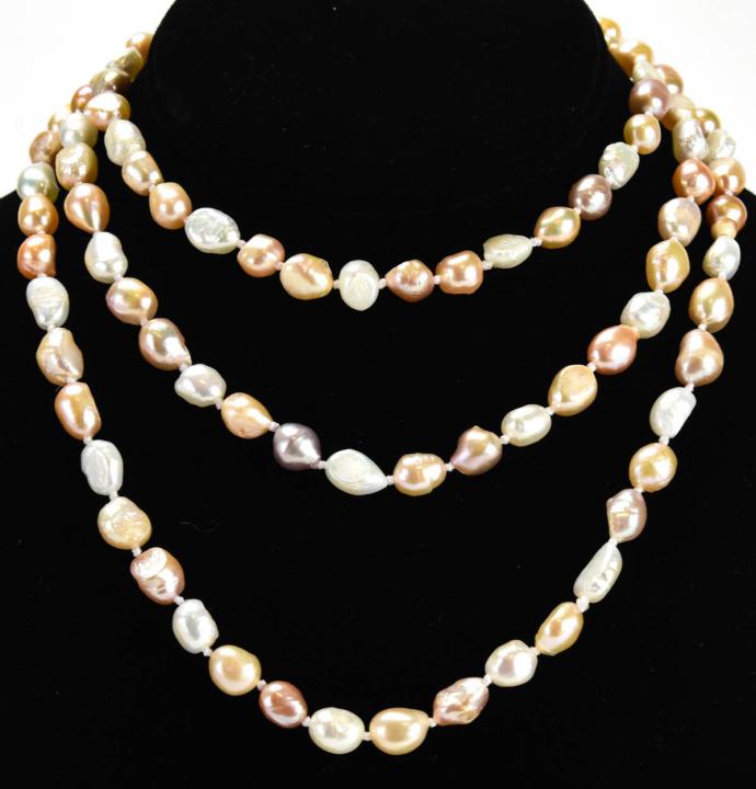 Hand Knotted Multi Color Baroque Pearl Necklace: Hand Knotted Multi Color Baroque Pearl Necklace. Measures approximately 48 inches in length. Tones of white, champagne, pink.