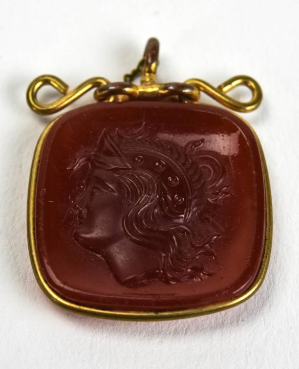 Antique 19th C Carnelian Cameo Necklace Pendant: Antique 19th C Carnelian Glass Cameo Necklace Pendant / Charm / Fob in Scrollwork Frame. Measures just over 1 inch in length.