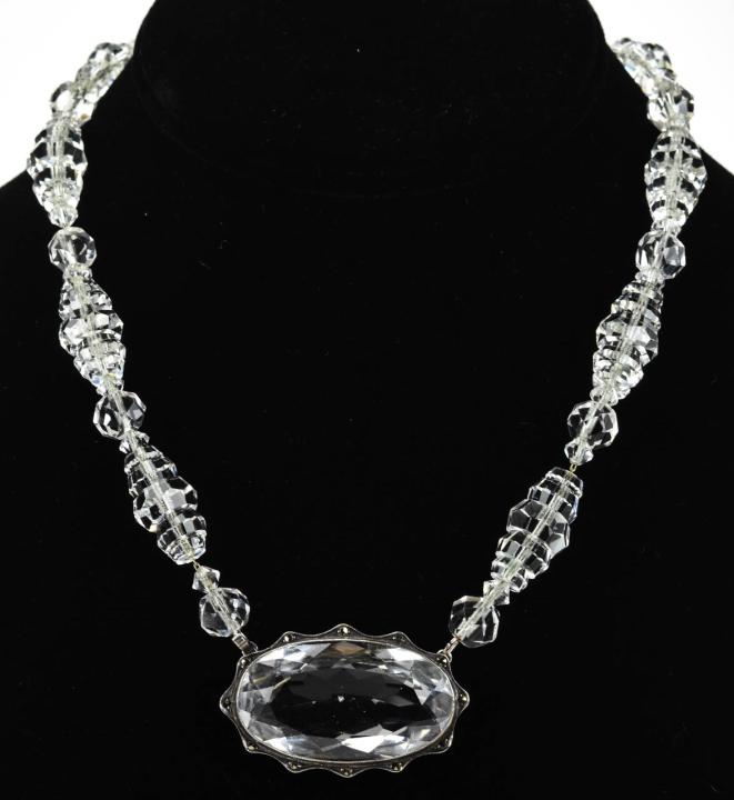 Antique Sterling Silver & Faceted Crystal Necklace: Antique Art Deco Sterling Silver & Faceted Crystal Necklace. Beads are strung on sterling silver chain. Large central crystal has a halo of rose cut marcasite stones. Measures 17.5 inches in length.