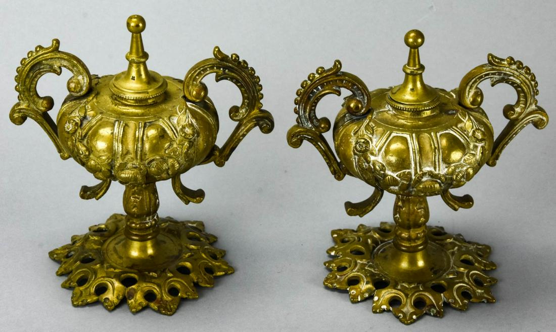 Pair Antique Ormolu Neoclassical Urns: Pair Antique Ormolu Neoclassical Urns. Each with floral swag motif. Each measures 7 inches x 6.5 inches x 4 inches.