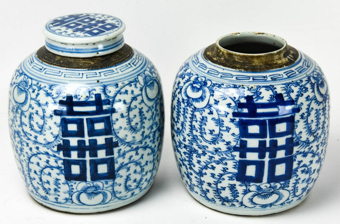 Pair Chinese Blue & White Porcelain Ginger Jars: Pair Chinese Blue & White Porcelain Ginger Jars. Blue and white with floral and character motif. Each measures approximately 9.5 inches x 7 inches.