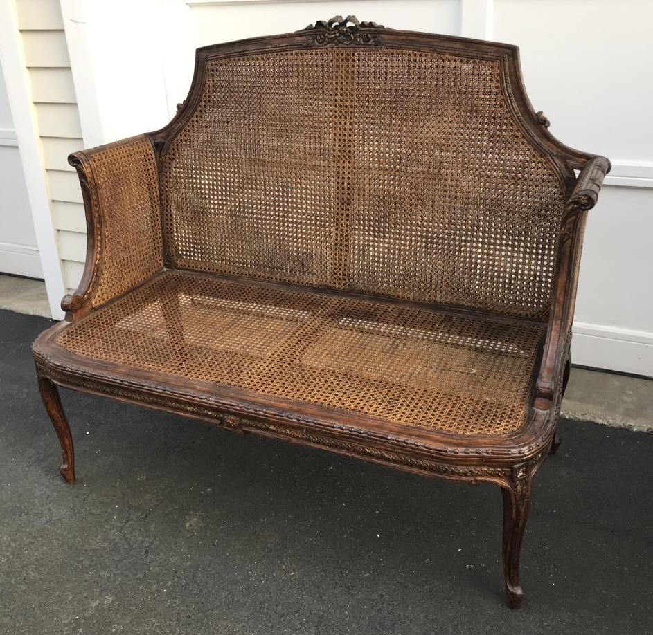 Antique French Provencal Carved & Caned Settee: Antique French Provencal / French Country Carved & Caned Settee or Hall Bench. Measures 41 x 49 x 22 inches.
