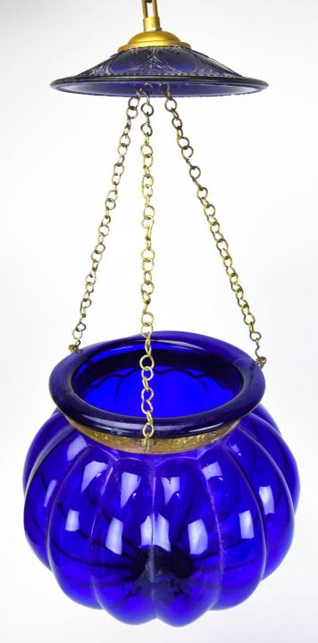 Mediterranean Style Blue Glass Pendant Light: Mediterranean Style Blue Glass Pendant Light. With brass banding and hardware. Measures approximately 19 inches x 8 inches.