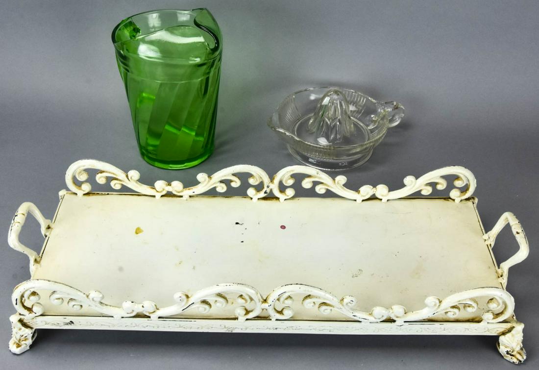 Painted Iron Serving Tray & Mid Century Glass: Painted Iron Serving Tray & Mid Century Glass. Green glass pitcher, clear glass lemon juicer, white painted iron tray. Tray measures 21 inches in length.