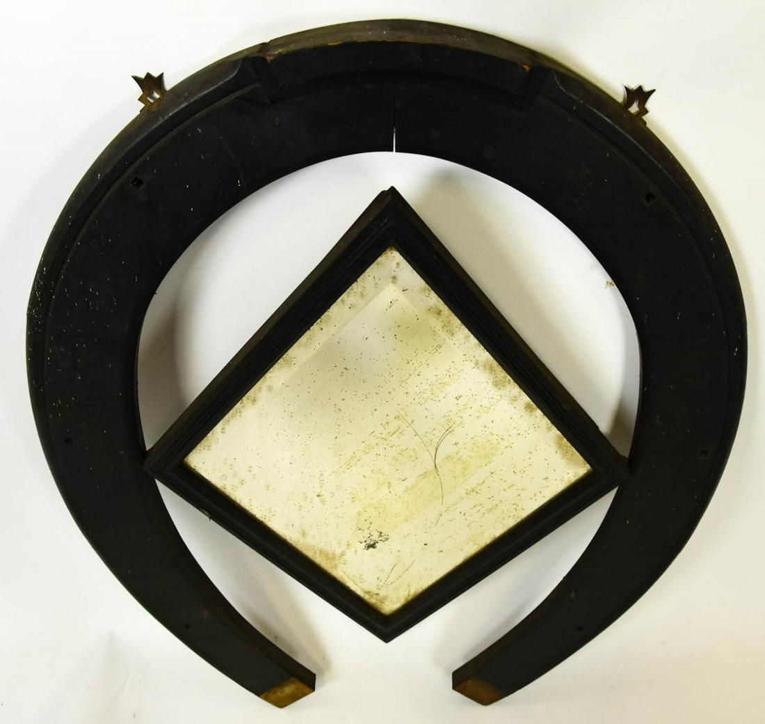 Antique Folk Art Horse Shoe Beveled Mirror: Antique Folk Art Horse Shoe Beveled Mirror. Antique folk art style black painted wood horse shoe frame with center diamond form beveled mirror. Measures 37 inches x 30 inches.