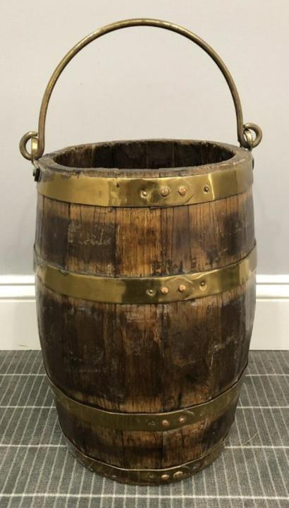 Hand Crafted Wood Barrel with Brass Rings: Hand Crafted Wood Barrel with Brass Rings, Handle. The barrel is crafted of wood planks and held together with brass rings with copper fittings. 15 inches x 11 inches in diameter.