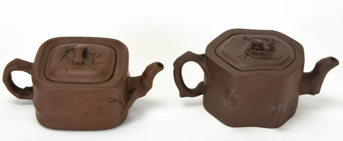 2 Chinese Pottery Teapots Signed: 2 Chinese Pottery Teapots Signed. Each with character mark on the bottom. Larger measures approximately 3.5 inches.