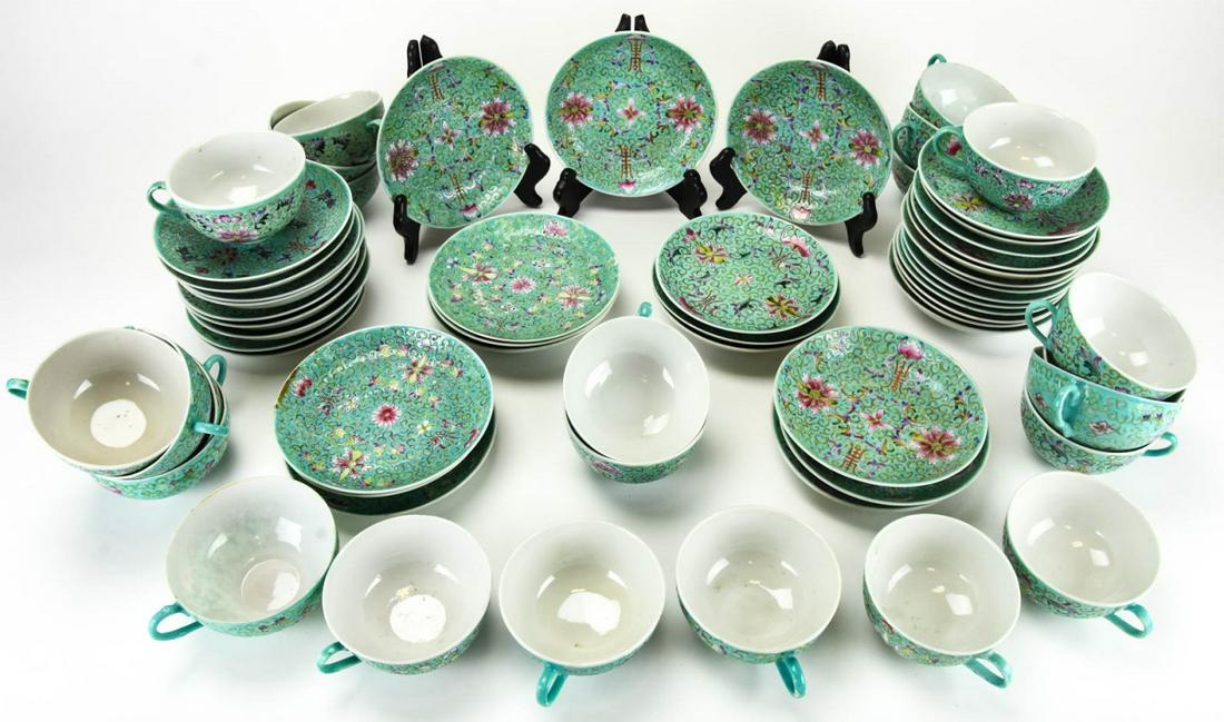 Chinese Famille Rose Porcelain Tea Set Signed: Chinese Famille Rose Porcelain Tea Set Signed. Includes 24 teacups and 37 saucers, each with character marks. Saucers each measure approximately 5.75 inches in diameter.