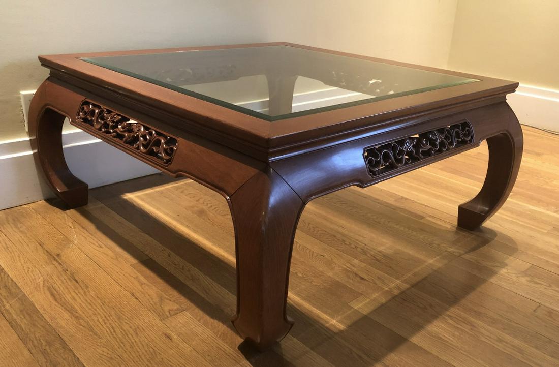 Asian Carved Rosewood Coffee Table Dragon Motif: Asian Carved Rosewood Glass Top Coffee Table with Dragon Motif. Carved rose wood coffee table with inlaid glass top. Apron has carved reticulated double dragon motif. 18 inches x 38 inches x 38 inches