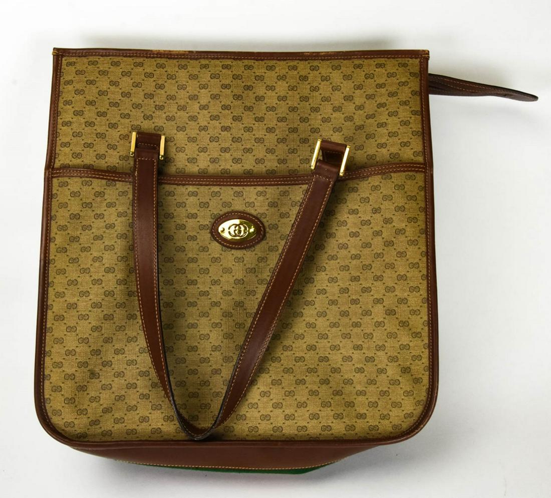 Vintage Gucci Monogram Tote w Gucci Stripe: Vintage Gucci Monogram Tote w Gucci Stripe. Authenticated Gucci Tote with Green and Red Gucci Stripe on sides. Minimal wave. 14 inches x 13 inches