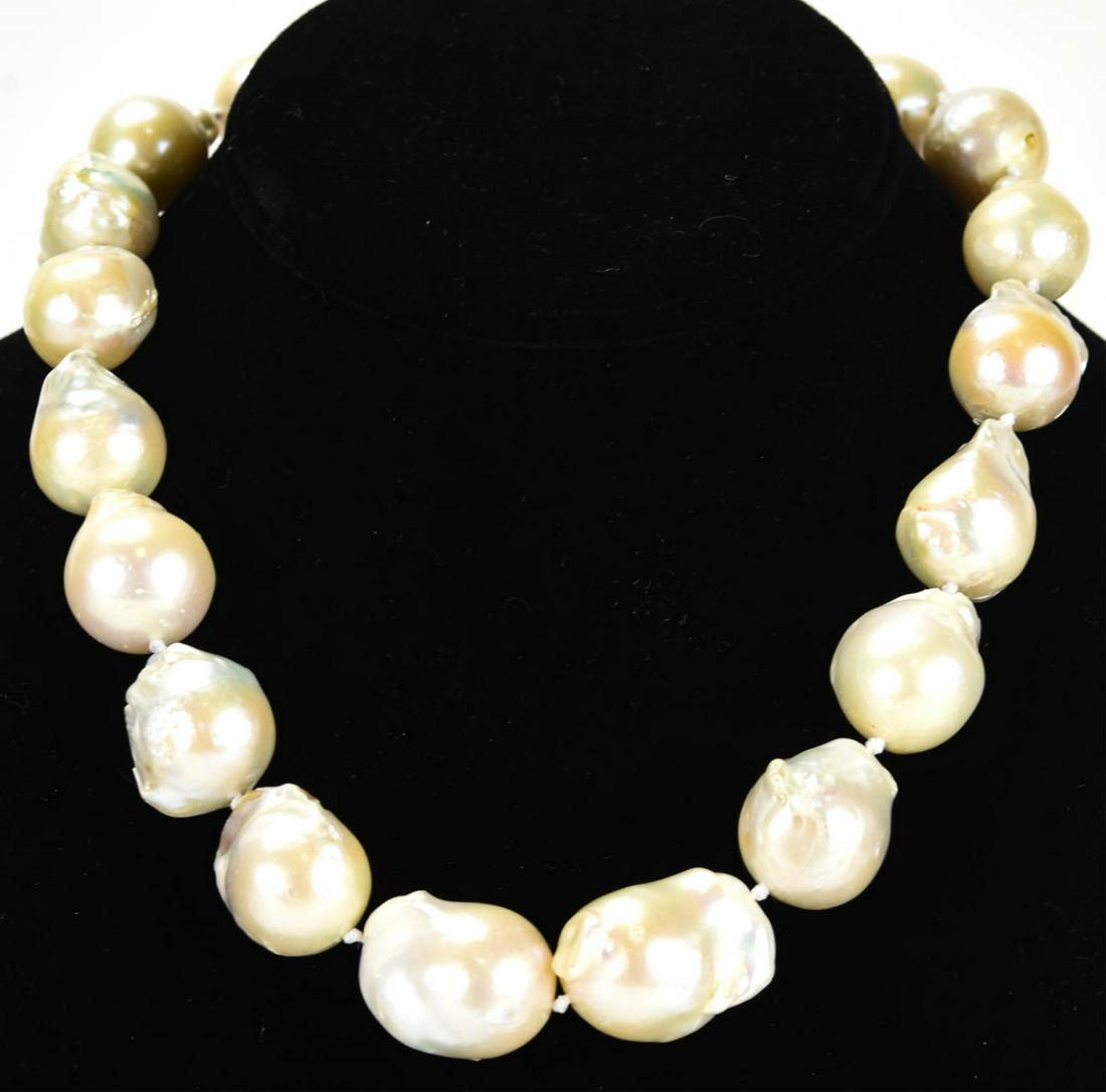 Large Baroque Cultured Pearl Necklace Strand: Large Baroque Cultured Pearl Necklace Strand. Hand knotted on white silk thread with large graduated size cultured baroque pearls in high luster tones of white, pink and champagne. Measures 18 inches 