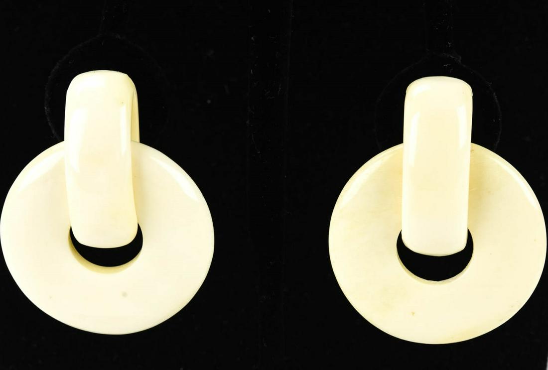 Vintage Carved Bone Door Knocker Earrings: Vintage Carved Bone Door Knocker Earrings. Signed MONIES. Clip on. Approximately 2 inches in length.