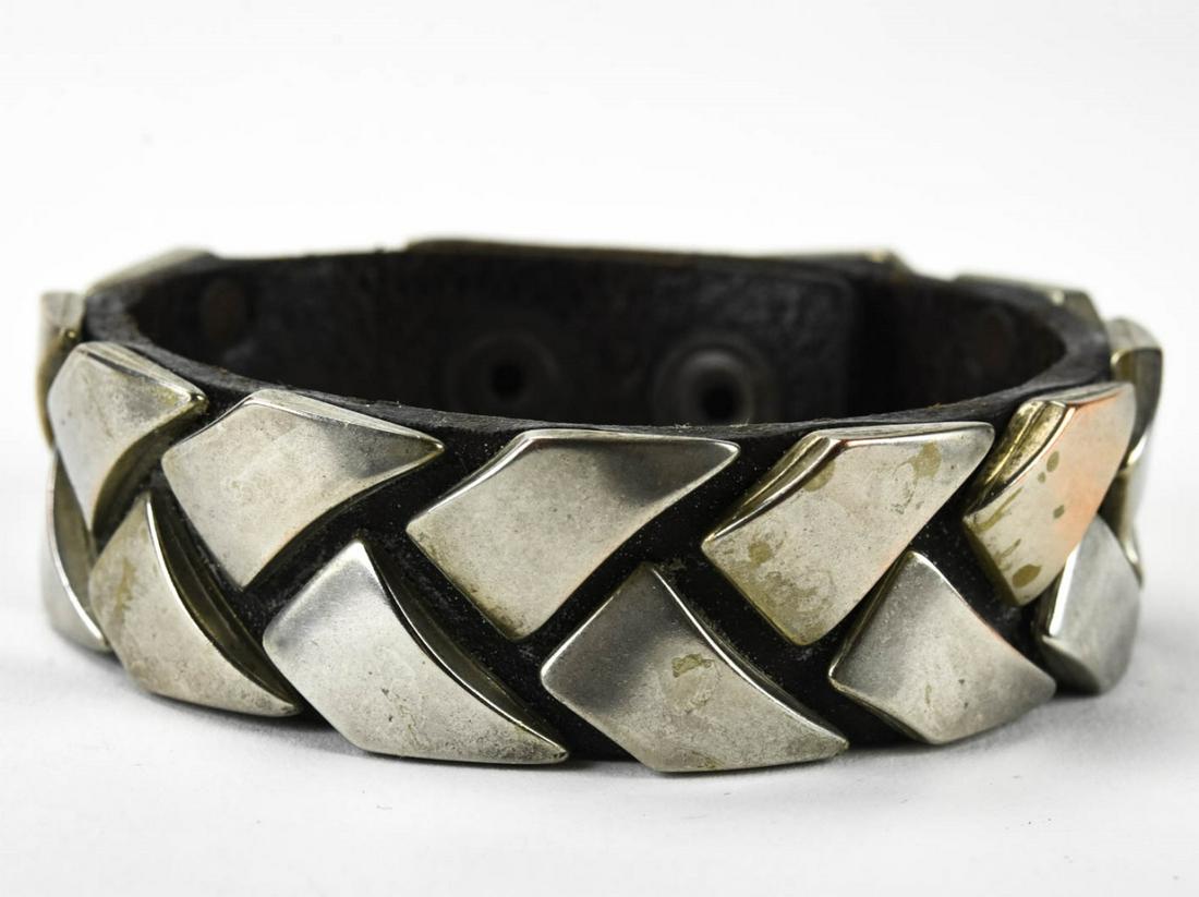 C 1990 Diesel Leather Strap & Silver Bracelet: C 1990 Diesel Leather Strap & Silver Bracelet. With rope twist design and snap closures. Measures 8 3/4 inches in length.