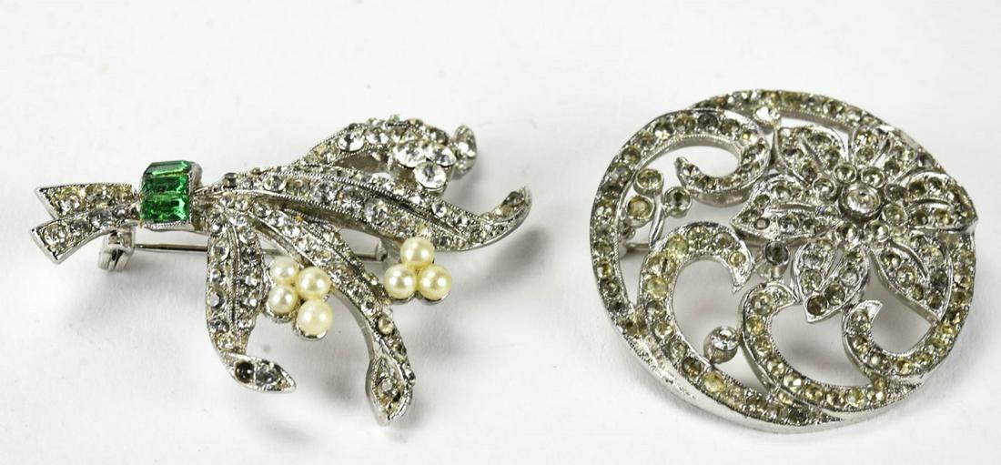 Two Vintage Rhinestone Set Floral Motif Brooches: Two Vintage Rhinestone Set Floral Motif Brooches or Pins. One with faux pearls and emerald paste measures 1.75 inches in length.
