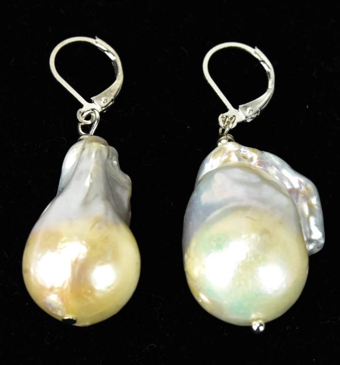 Large High Luster Cultured Baroque Pearl Earrings: Pair of Large High Luster Cultured Baroque Pearl Earrings. Each measures 2 inches in length.