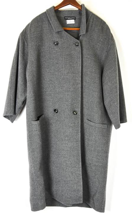 Geoffrey Beene Grey Wool Full Length Coat: Geoffrey Beene Grey Wool Full Length Coat. With shoulder pads, collar, pockets. Measures approximately 24 inches across the shoulders, 18 inches from shoulder to cuff, and 45.5 inches overall.