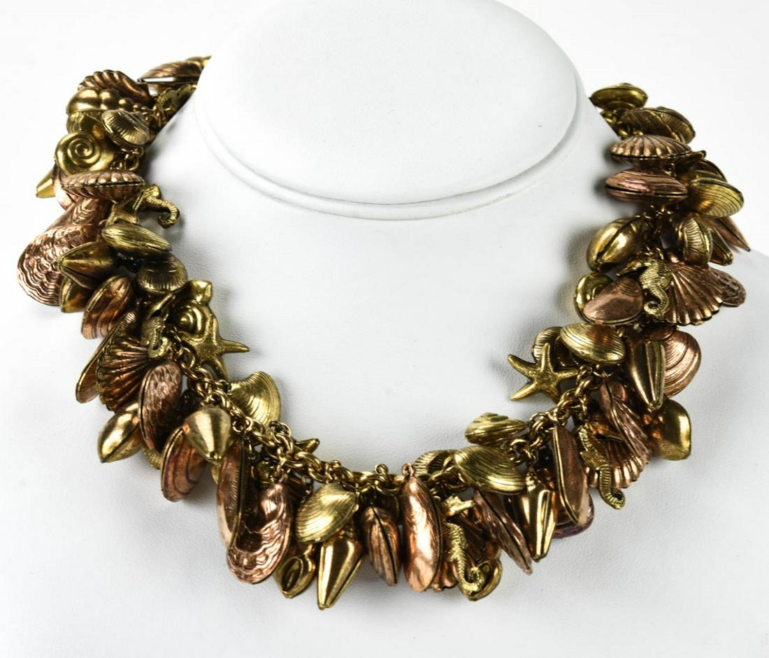 Vintage C 1940s Gilt Metal Seashell Charm Necklace: Vintage C 1940s Gilt Metal Seashell Charm Necklace. Measures 16 inches in length.