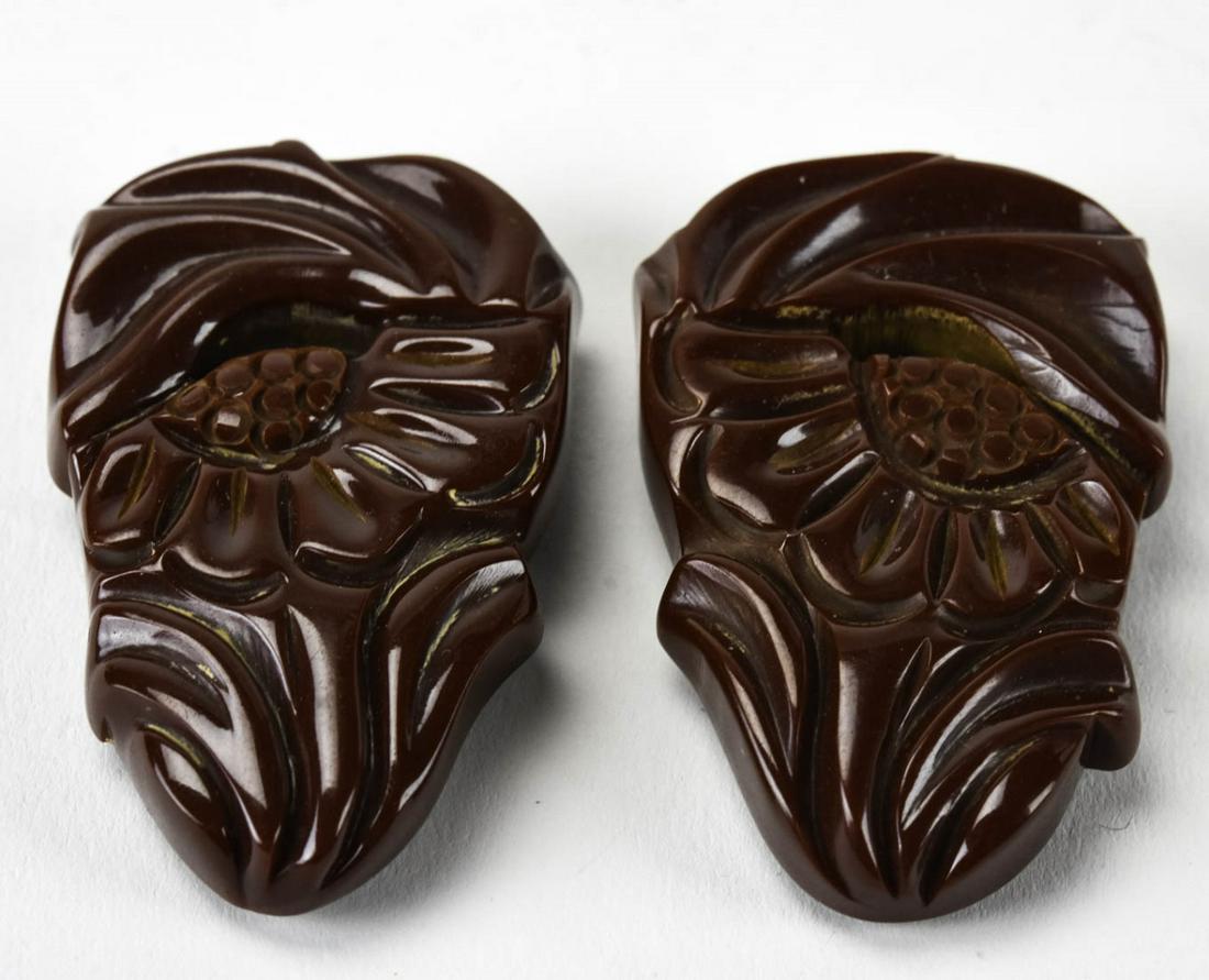 Vintage Pair C 1940s Chocolate Bakelite Clips: Vintage Pair C 1940s Chocolate Bakelite Clips. Each measures 2 inches in length.