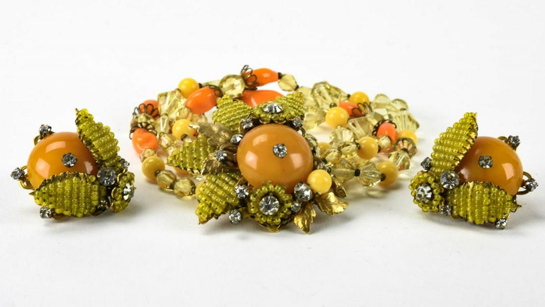 Vintage Miriam Haskell Bracelet & Earring Set: Vintage Miriam Haskell Bracelet & Earring Set. Micro art glass beads, rhinestones, faux amber. Clip on earrings. Double strand bracelet measures 7.25 inches in length.