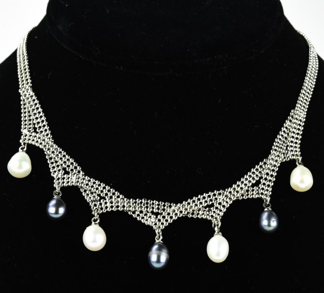 Mesh Metal & Two Tone Baroque Pearl Necklace: Mesh Metal & Two Tone Baroque Pearl Necklace. Silver tone mesh metal white and silver tone baroque pearls. Measures 14.5 inches in length.