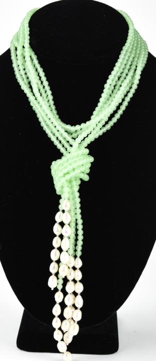 Three Strand Lariat Necklace in Emerald & Pearl: Three Strand Lariat Necklace in Emerald Tone Beads & Baroque Pearl. Beads test as Topaz on the Presidium. Measures 30 inches to the knot / pearl drops.