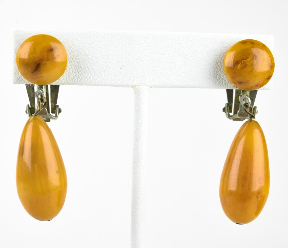 Pair Vintage Butterscotch Bakelite Clip Earrings: Pair Vintage Butterscotch Bakelite Clip Earrings. Each measures 1.75 inches in length.