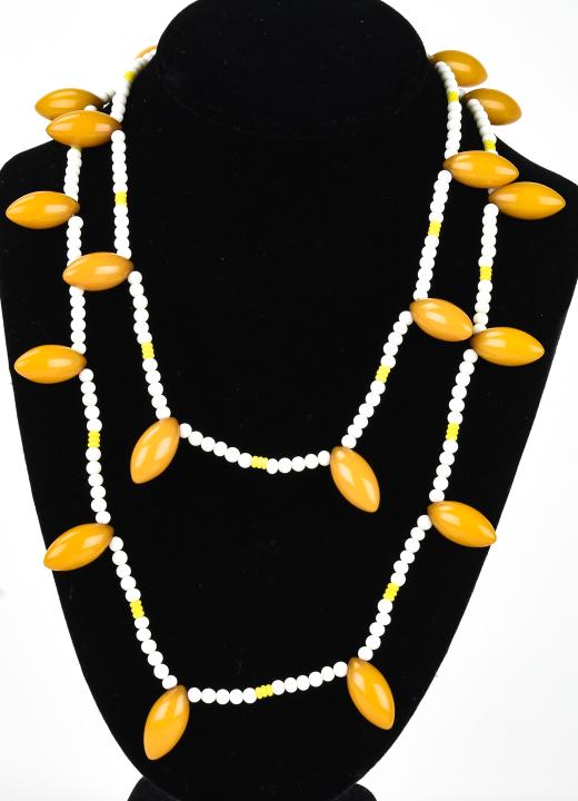 Vintage Bakelite & Art Glass Beaded Necklace: Vintage Bakelite & Art Glass Beaded Necklace. Amber / butterscotch tone bakelite and art glass beads. Measures 44 inches in length.