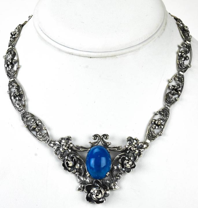 Antique C 1920s Sterling Silver Sodalite Necklace: Antique C 1920s Sterling Silver Sodalite Necklace in the Renaissance Revival Style. Measures 15.5 inches in length.