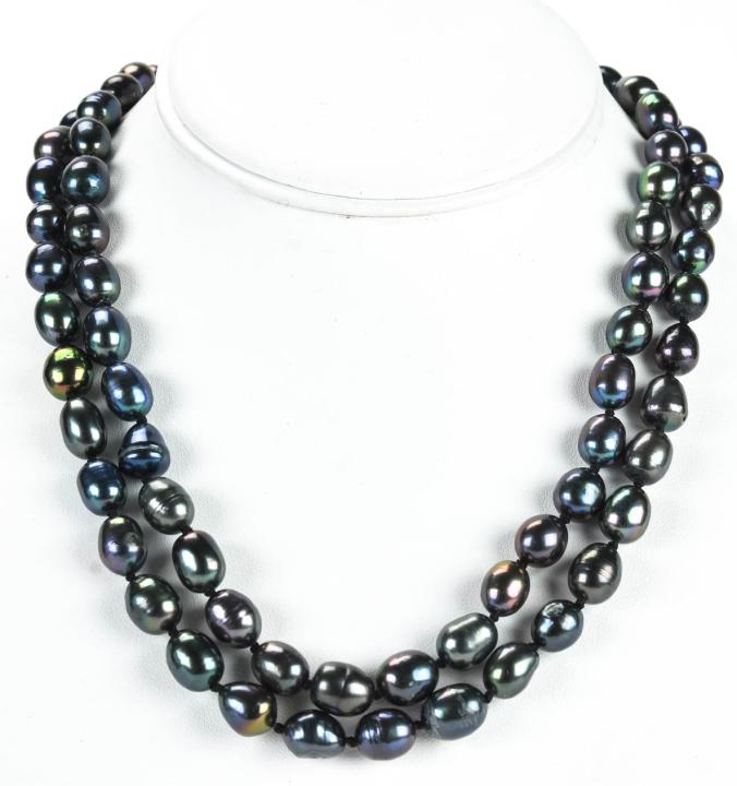 Pair of Cultured Tahitian Black Pearl Necklaces: Pair of Cultured Tahitian Black Pearl Necklaces. Hand knotted on black silk thread with tones of black, gray and silver. Filigree clasps. Each measures 18 inches in length.