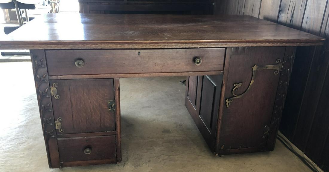 Antique Carved Arts & Crafts Partner Desk: Antique Carved Arts & Crafts Partner Desk with Hand Forged Hardware. Multiple interior compartments on both sides of partner desk. 30 inches x 60 inches x 36 inches