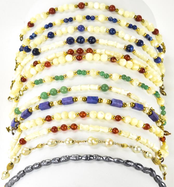 10 Carnelian Mother of Pearl Lapis & 14k Bracelets: 10 Carnelian Mother of Pearl Lapis & 14k Bracelets. 10 carnelian, lapis, faux pearl, mother of pearl bead bracelets including 14kt yellow gold beads and / or clasps. 7.5 inches in length.