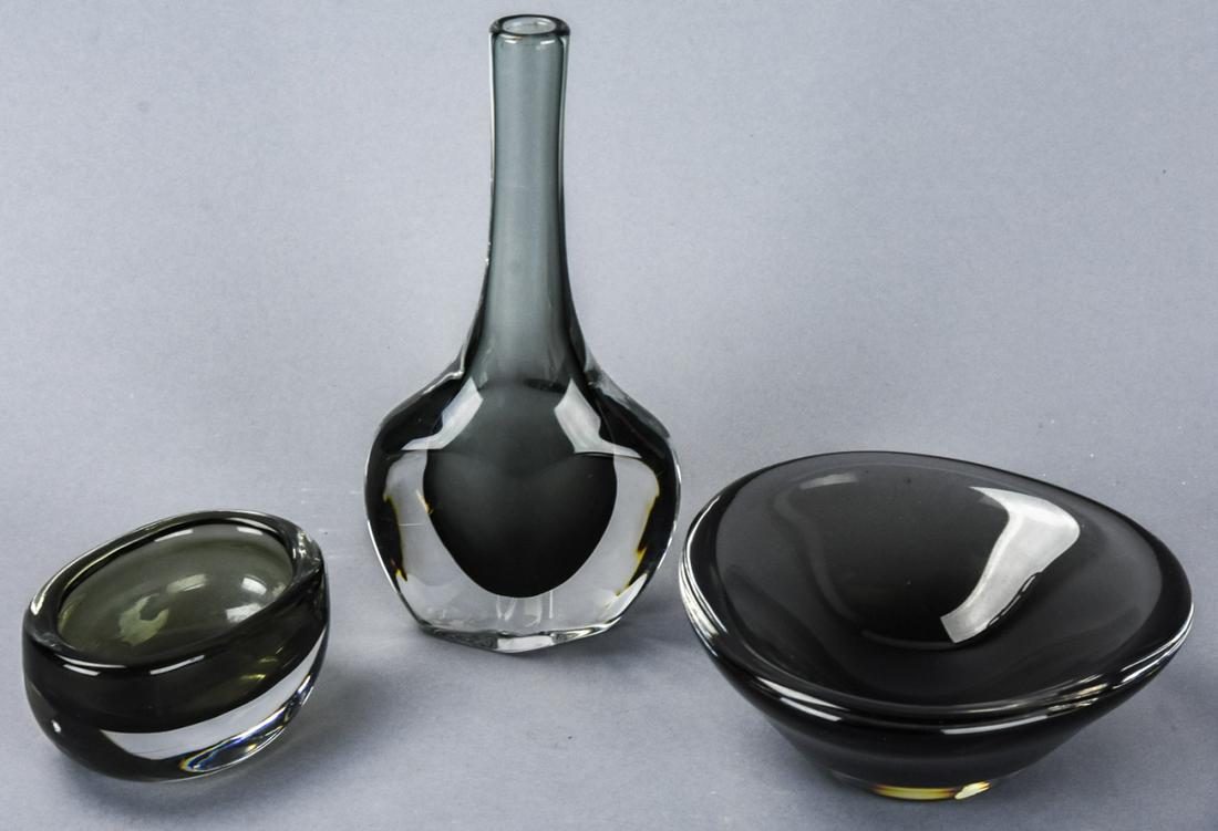 Orrefors Black Art Glass Vase and 2 Bowls: Orrefors Black Art Glass Vase and 2 Bowls. All pieces are signed. Largest bowl is approximately 2.5 inches x 6 inches in diameter.