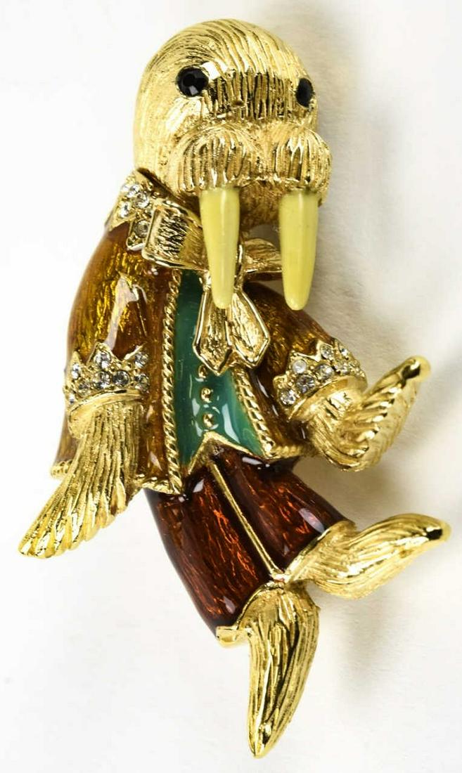 Vintage Ciner Brooch Based on Donald Calfan Design: Vintage Ciner Brooch Based on Donald Calfan Design. Circa 1970s. Vintage gilt metal, rhinestone and enamel walrus design brooch based on the Tiffany design by Donald Calfan. Measures 2.5 inches in len