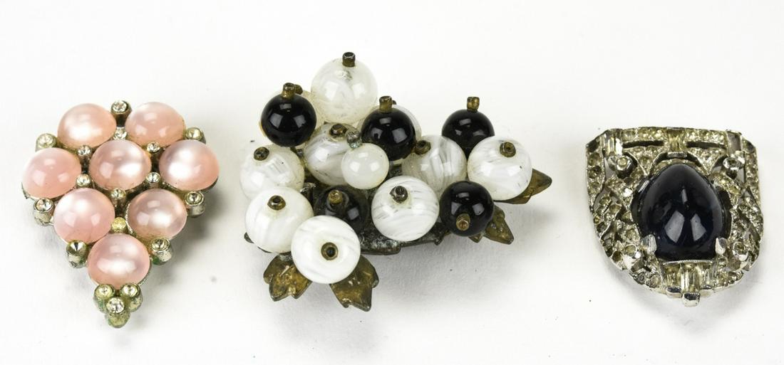 Three Antique & Vintage Costume Jewelry Clips: Three Antique & Vintage Costume Jewelry Clips. Featuring Art Deco and Retro designs with sapphire paste, faux moonstones, rhinestones and art glass beads. Largest measures 1.75 inches in length.