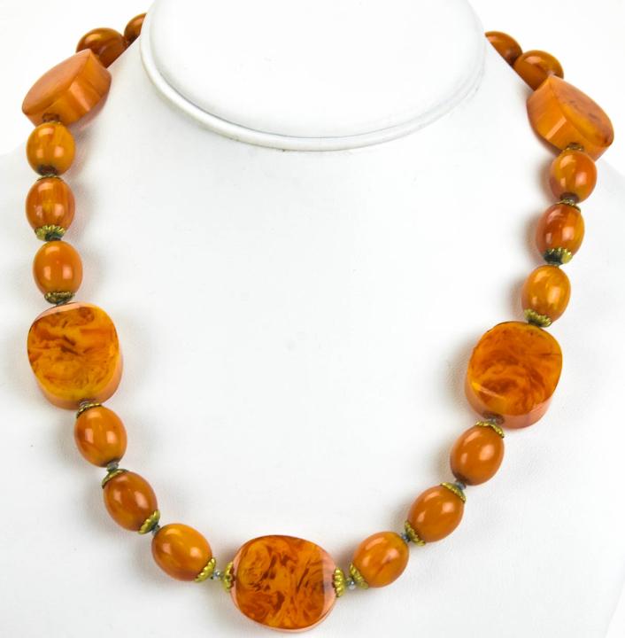 Vintage Costume Czechoslovakia Faux Amber Necklace: Vintage Costume Czechoslovakia Faux Amber Necklace. Clasp is marked Czechoslovakia. Faux butterscotch amber, possibly Bakelite. Measures approximately 20 inches in length.