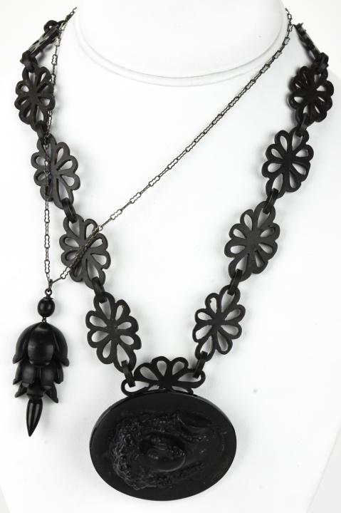 Antique Black Jet, Horn, Bog Oak Mourning Jewelry: Lot of Antique Black Jet, Horn, Bog Oak Mourning Jewelry – Lot includes 3 pieces of jewelry including a hand carved 19” x .75” chain that appears to be horn or bog oak. A large cameo is jet and 