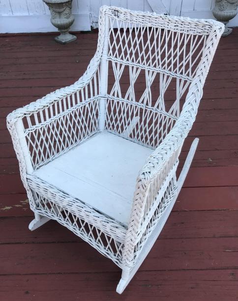 Vintage American Wicker Rocking Armchair: Vintage American Wicker Rocking Armchair. Measures 32.5 x 22 x 33.5 inches.