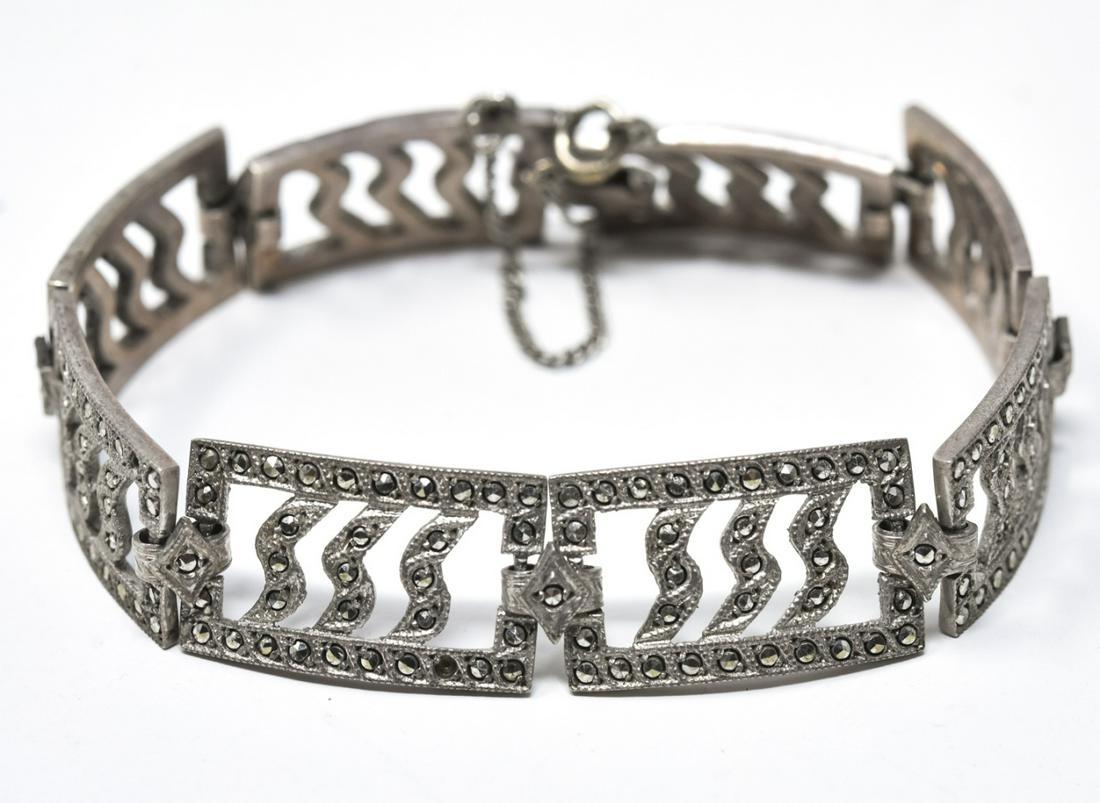 Art Deco Sterling and Marcasite Bracelet: Art Deco Sterling and Marcasite Bracelet – Stamped STERLING on clasp. This panel bracelet is approximately 7” long x .5” wide.