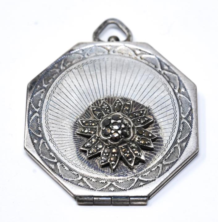 Sterling Art Deco Style Locket Necklace Pendant: Sterling Art Deco Style Locket Necklace Pendant. Floral design with marcasite. Measures 1.5 inches in length.