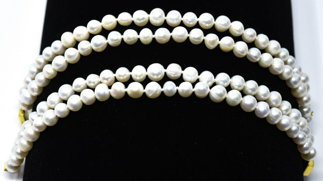 Pair of Hand Knotted Baroque Pearl Bracelets: Pair of Hand Knotted Baroque Pearl Bracelets w Filigree Clasps. Hand knotted on silk thread. Each measures approximately 8 inches in length.