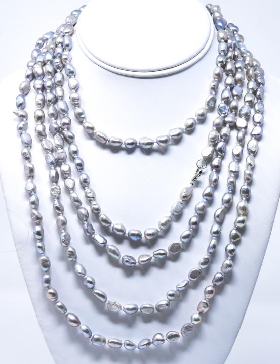 Impressive 100 Inch Hand Knotted Pearl Necklace: Impressive 100 Inch Hand Knotted Pearl Necklace. Silver tone baroque pearls. Approximately 100 inches in length.