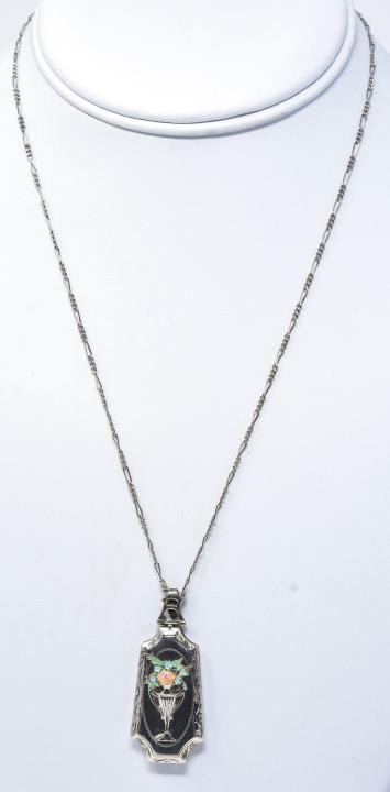Antique Art Deco Sterling & Enamel Locket Necklace: Antique Art Deco Sterling & Enamel Locket Necklace. Floral decoration. Locket measures 1.75 inches, chain measures 18 inches in length.