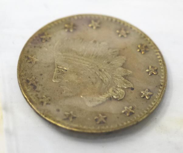 1855 Indian Head California Fractional Gold Coin: 1855 Indian Head California Fractional Gold Coin. Half dollar coin. Measures approximately 7/16 of an inch in diameter.
