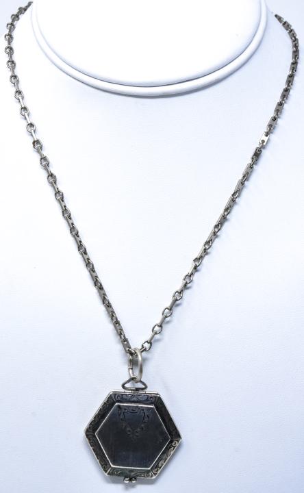 Antique Art Deco Sterling Silver Locket Pendant: Antique Art Deco Sterling Silver Locket Pendant on a Chain. Chain measures 17 inches in length.